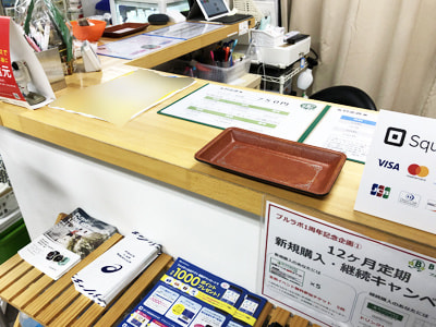 ランニングステーションでのスポーツに関心の高い働く男女に向けた東京2020サポートメンバー募集チラシの設置サンプリング事例